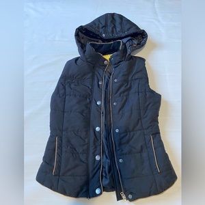 black vest with pockets and hoodie